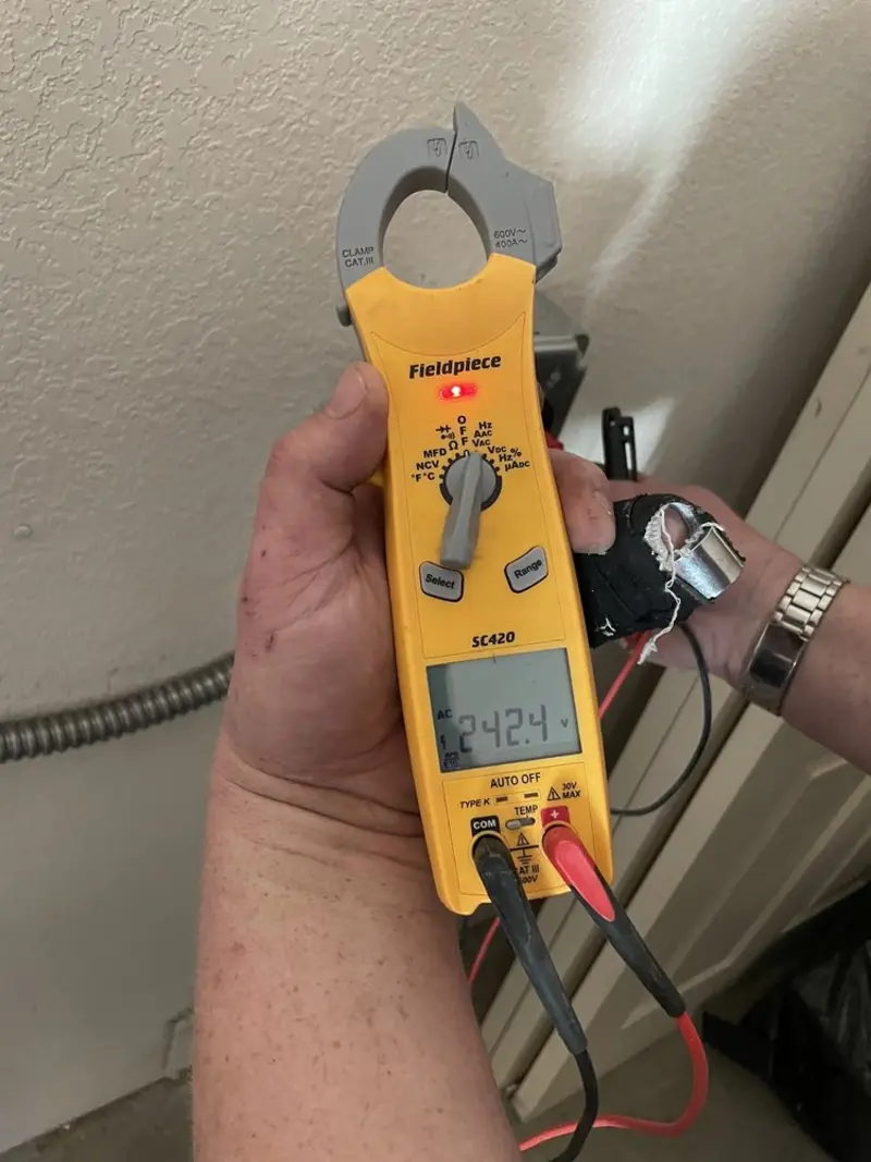 Voltage testing with clamp meter during Electrical Installation Services in Lincoln Park
